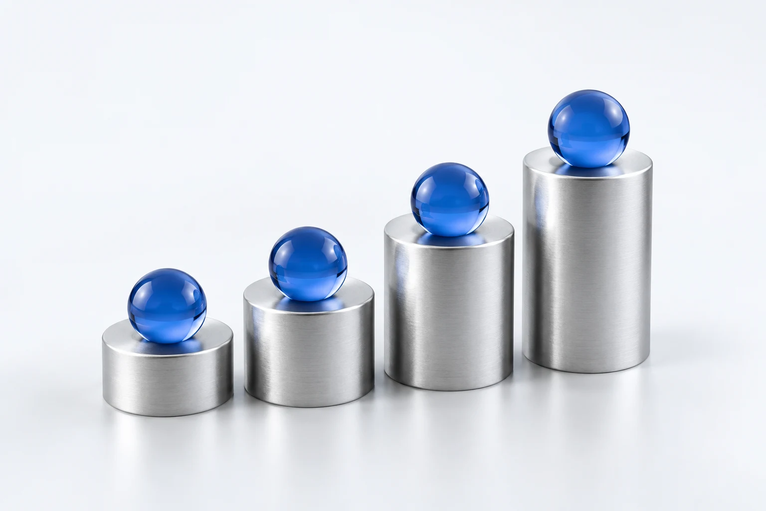 Glass spheres progressing over silver platforms